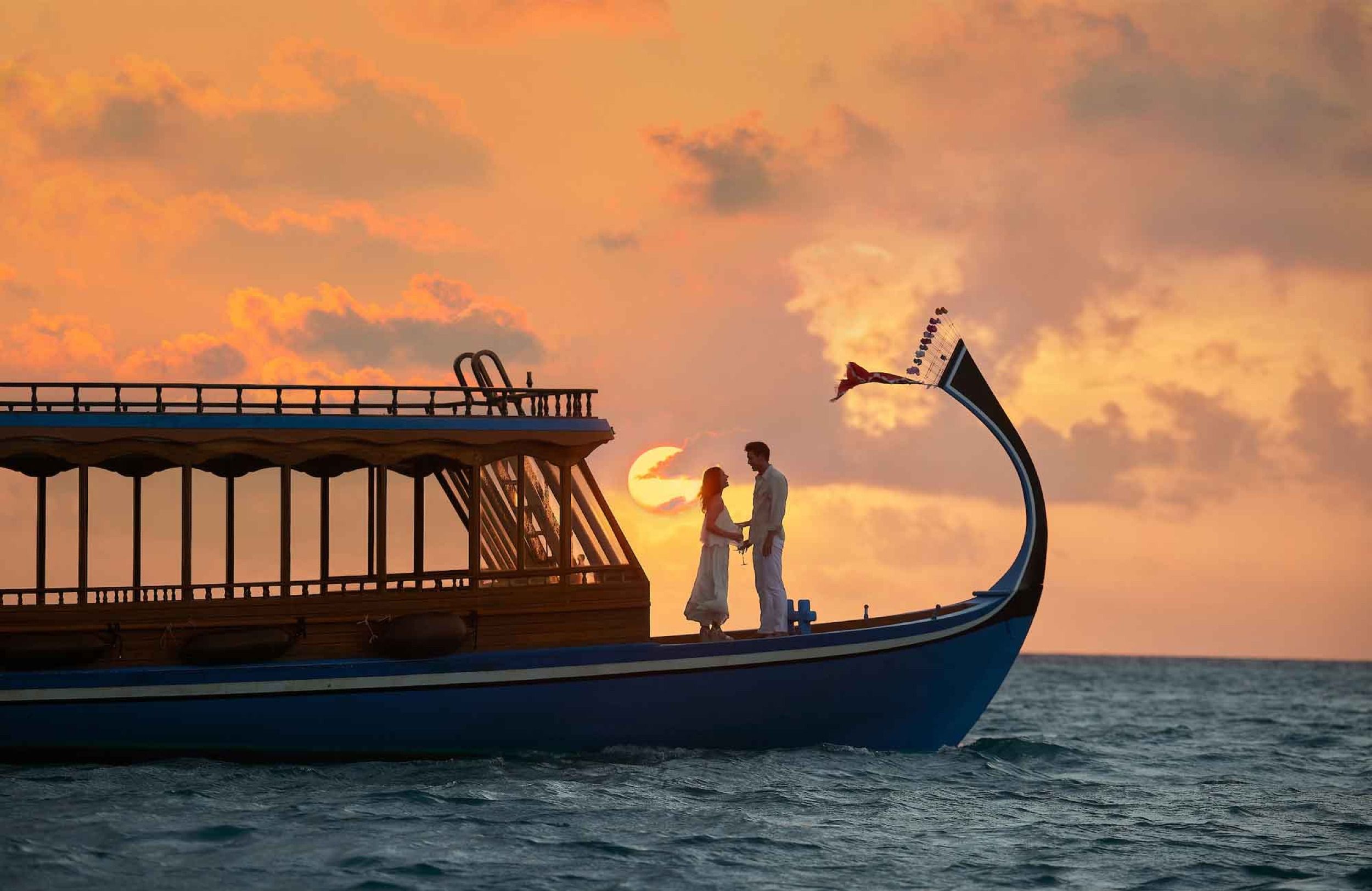 Couple on a traditional Maldivian dhoni