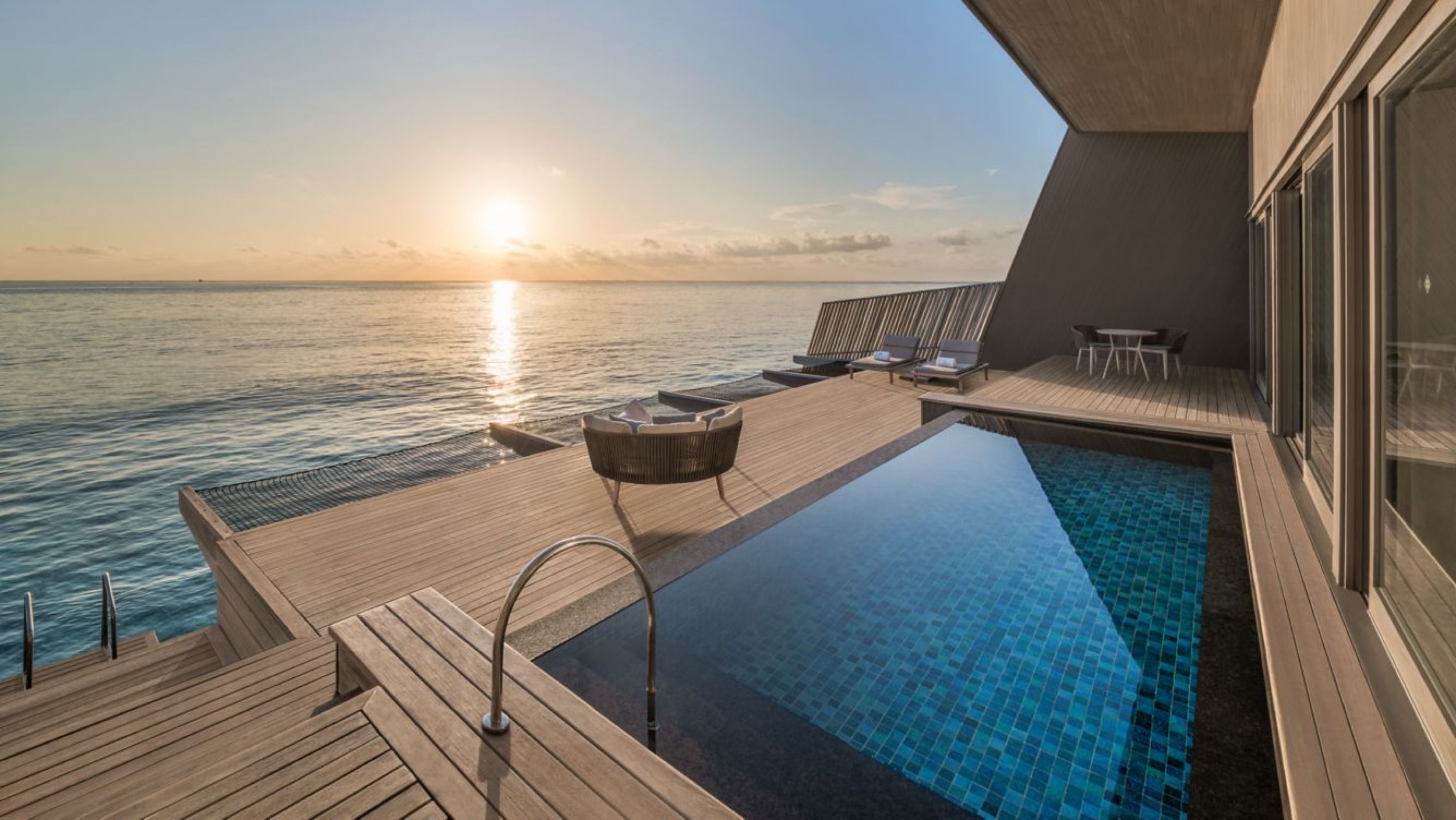 Over Water Villa with Pool
- exterior pool with sunset - The St. Regis Maldives Vommuli Resort