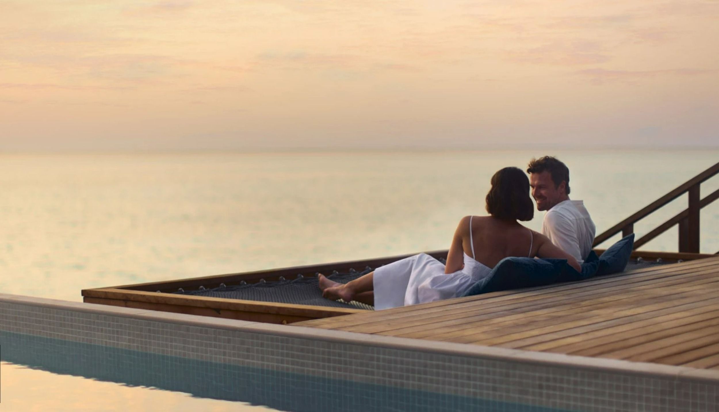 Couple enjoying the sunset view.