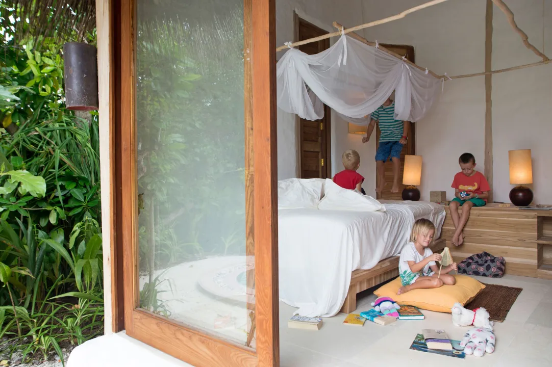 Children in a cozy family villa at Soneva Fushi Maldives – luxury stay with playful indoor space in a tropical island resort.