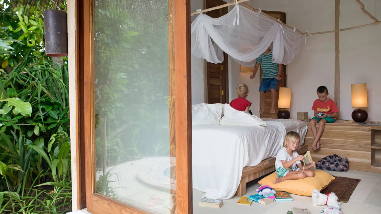 Children in a cozy family villa at Soneva Fushi Maldives – luxury stay with playful indoor space in a tropical island resort.