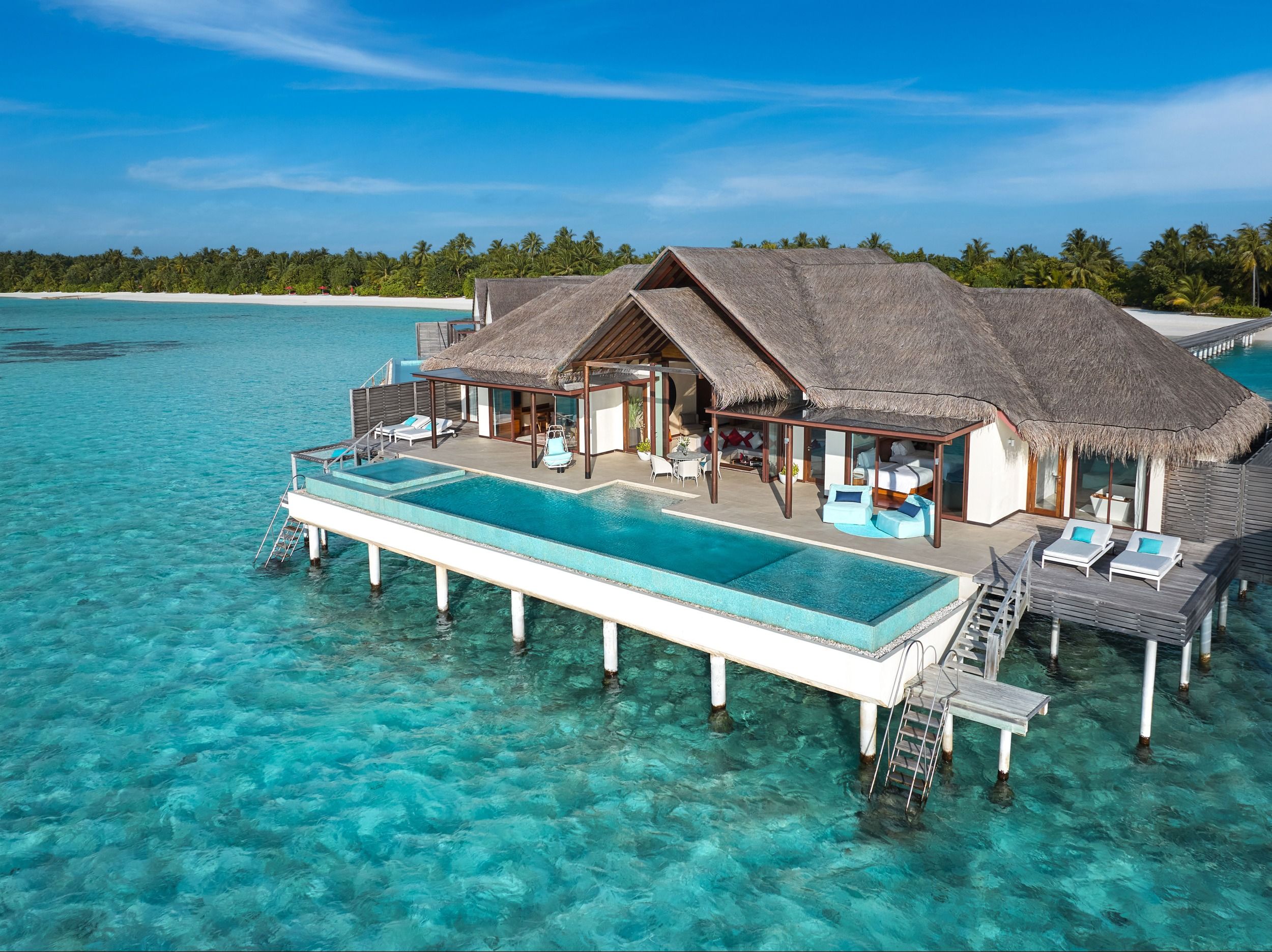 An exterior view of a Two Bedroom Ocean Pool Pavilion with pool in the foreground.