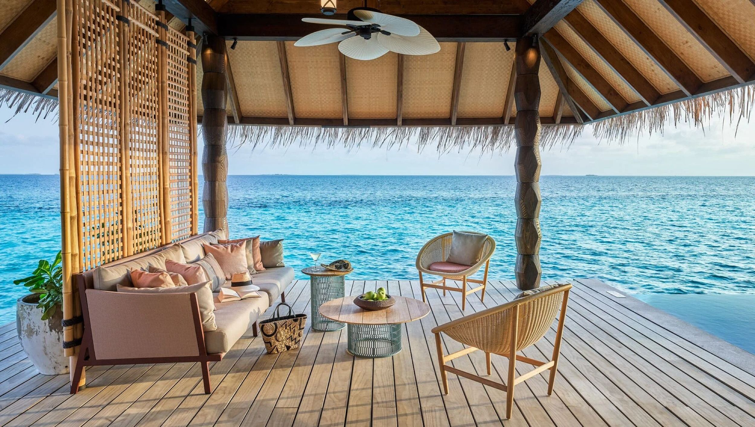 Luxury Water Villa with Pool outdoor deck with seating at Joali Maldives