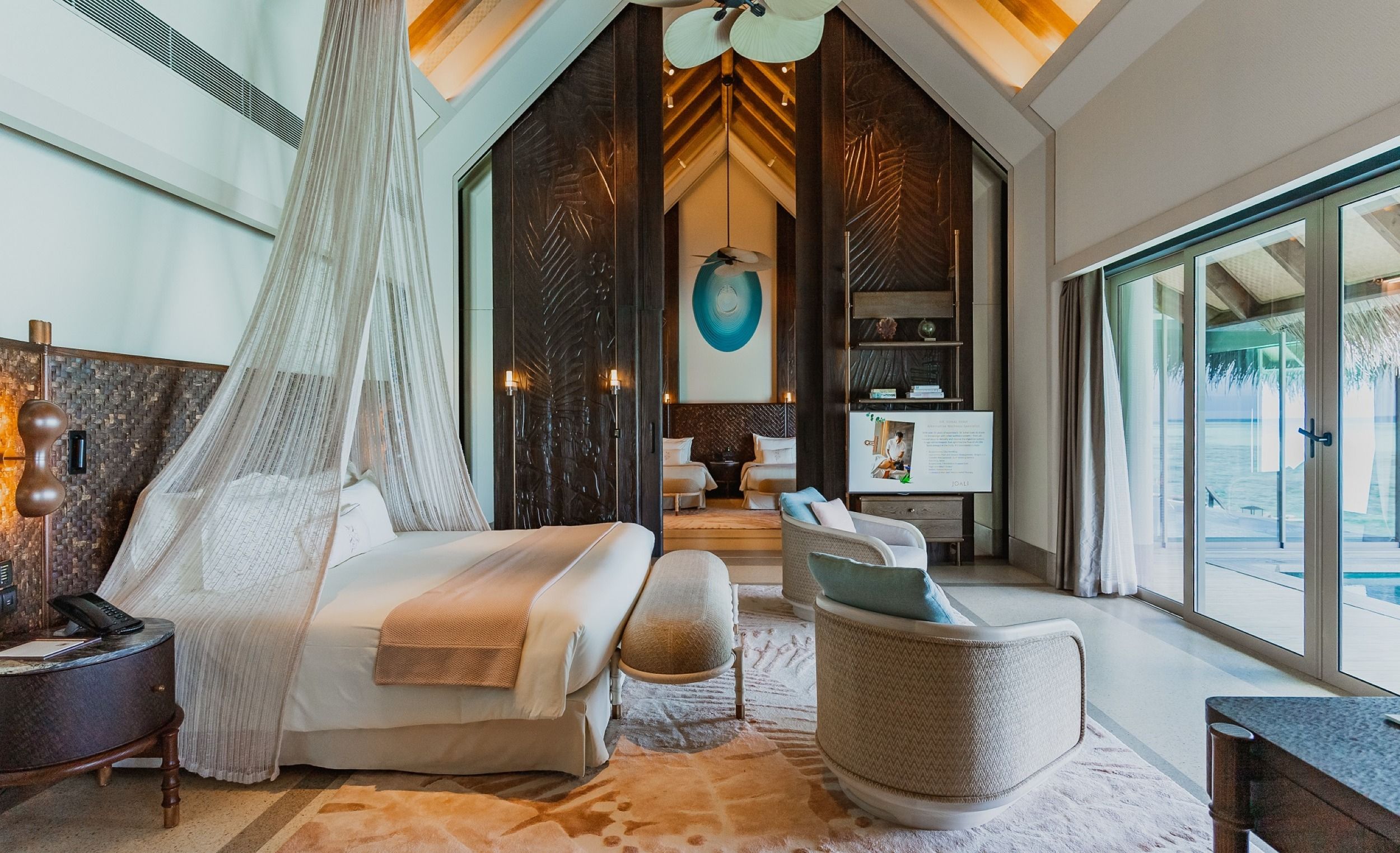 Main bedroom with a glimpse of the twin bedroom