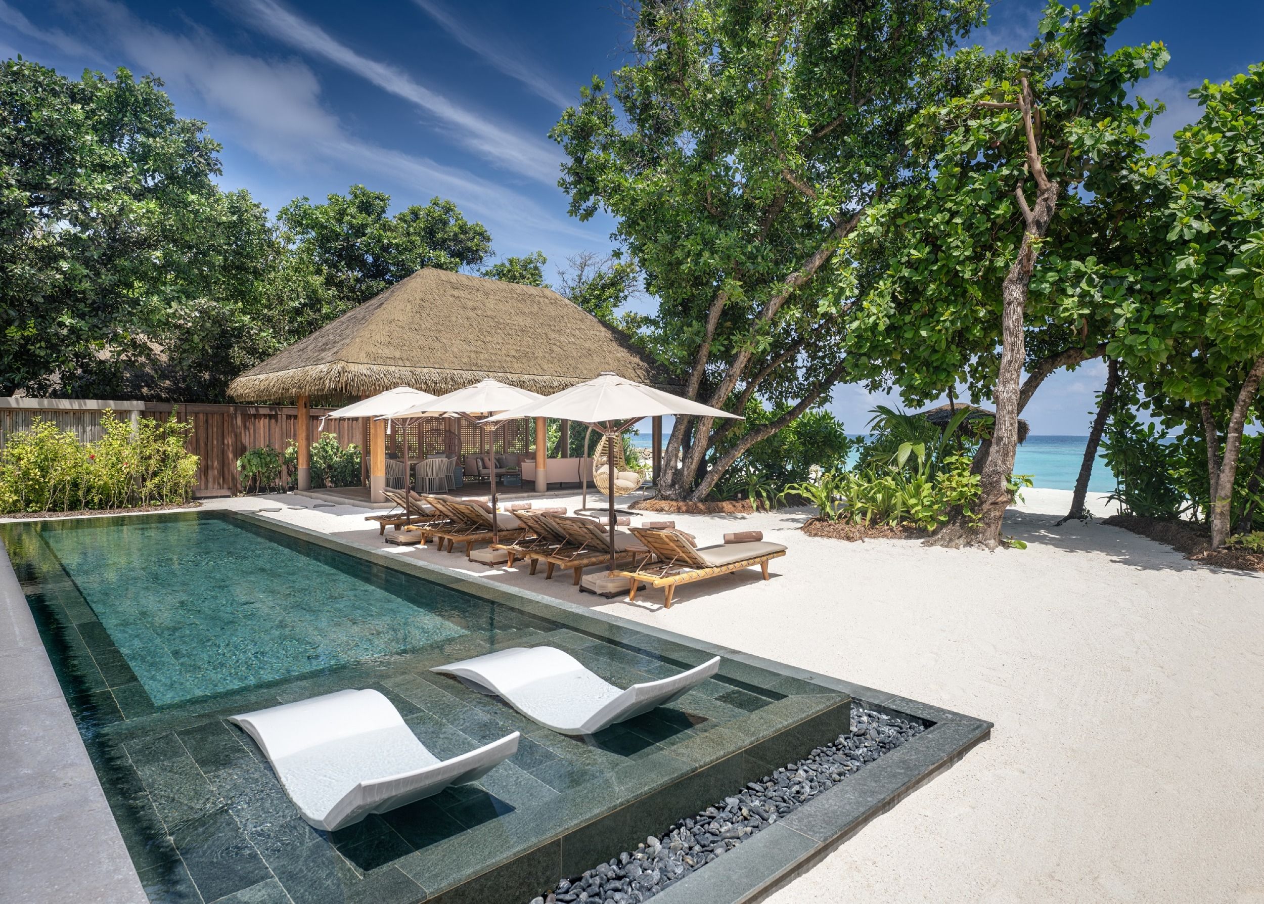 Pool and sun loungers- Three Bedroom Beach Residence with Pool