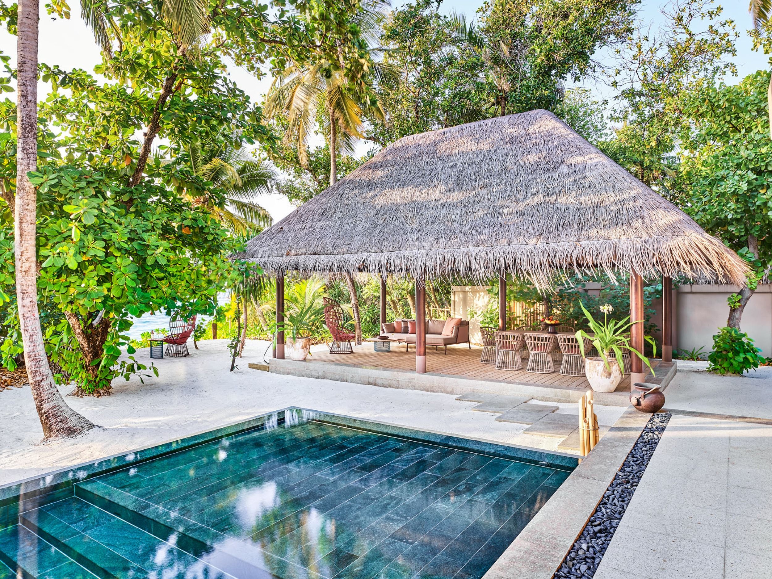 Large private infinity pool surrounded by lush tropical vegetation