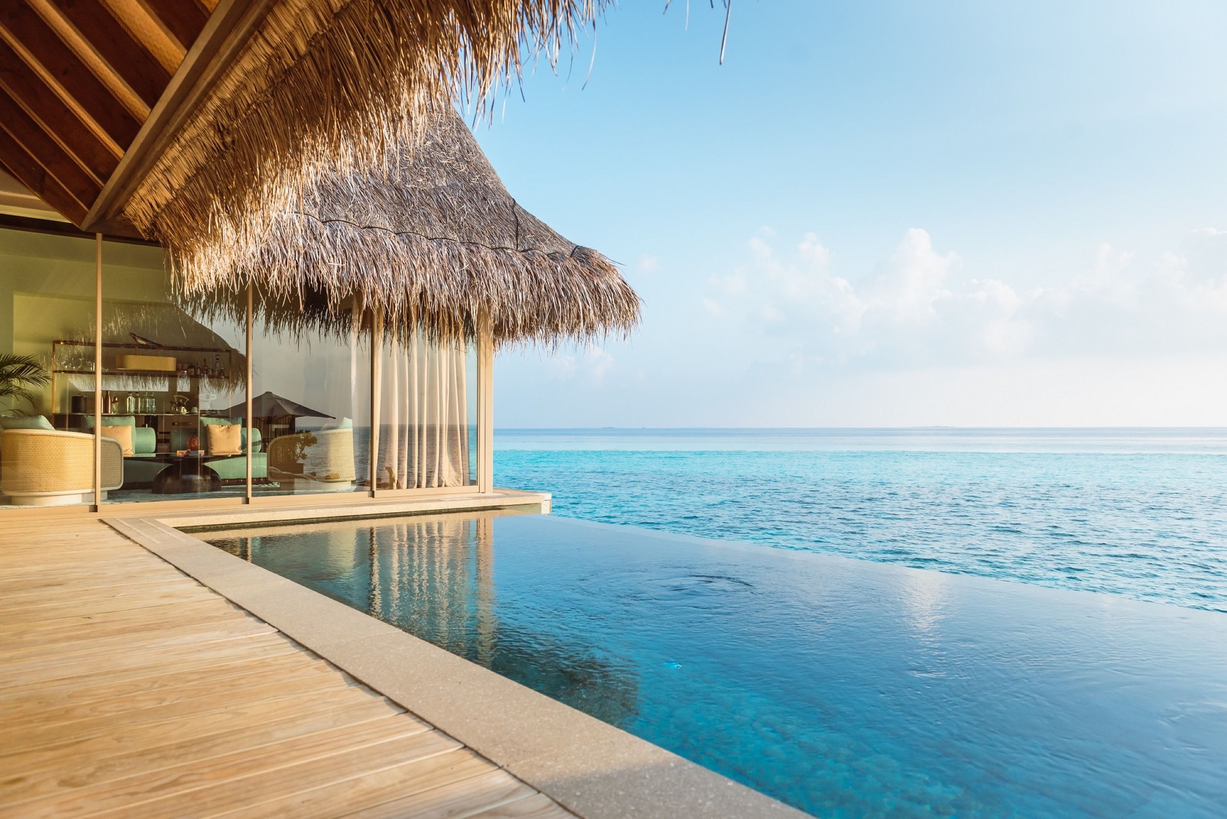Overwater terrace with infinity pool overlooking Indian Ocean at Joali Maldives