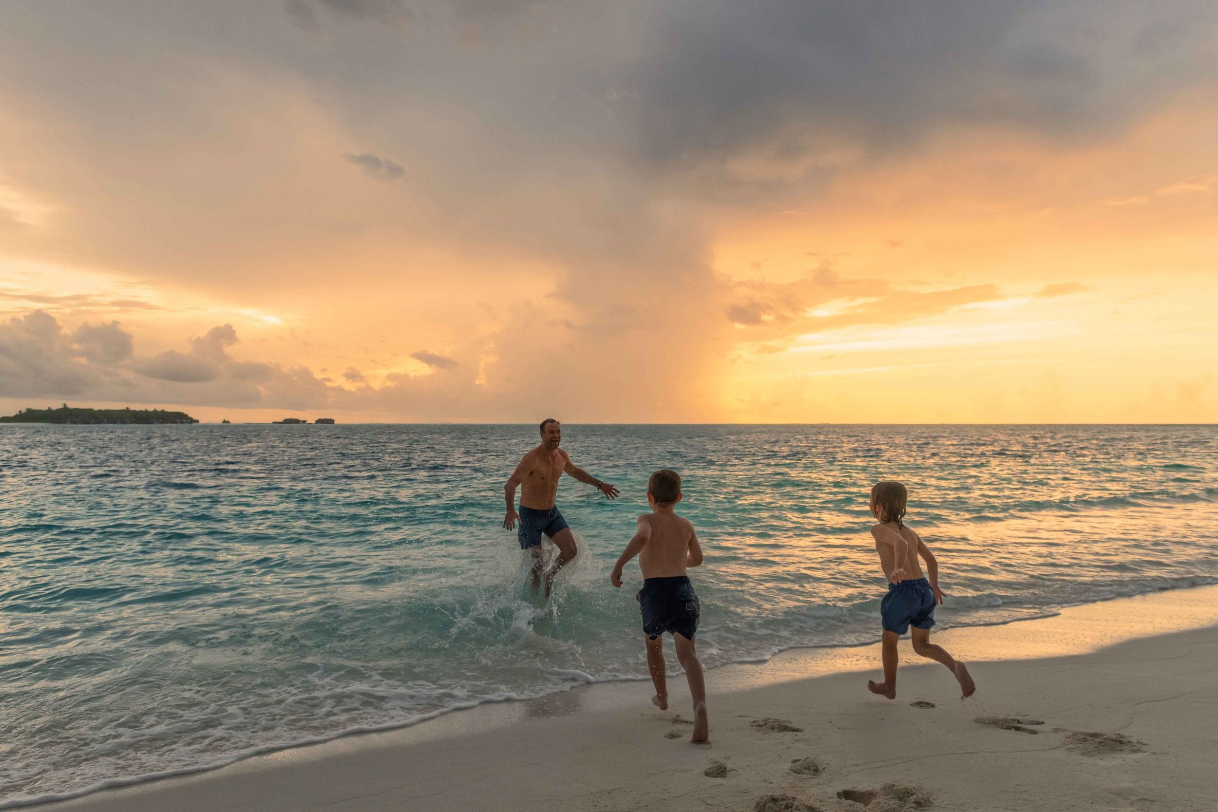 Family Beach Sunset Playing