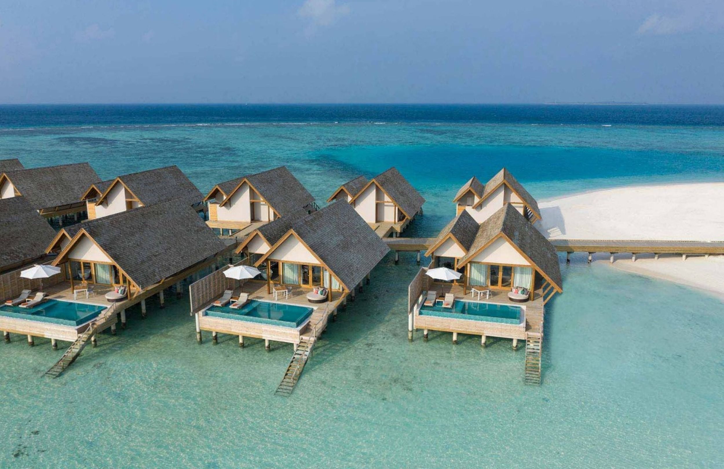 aerial view sunset water villa with pool