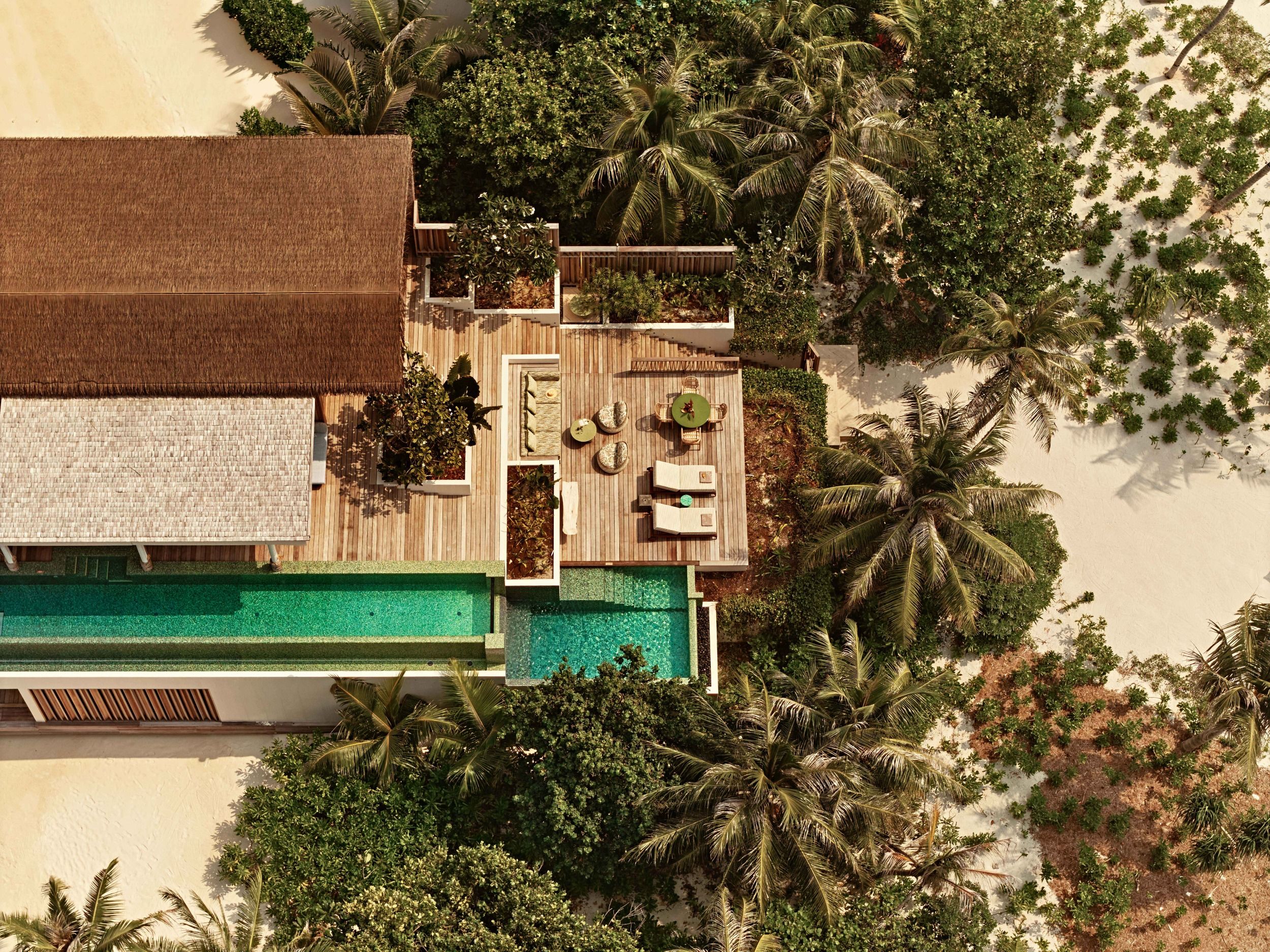 Aerial ocean-side view of three-bedroom residence