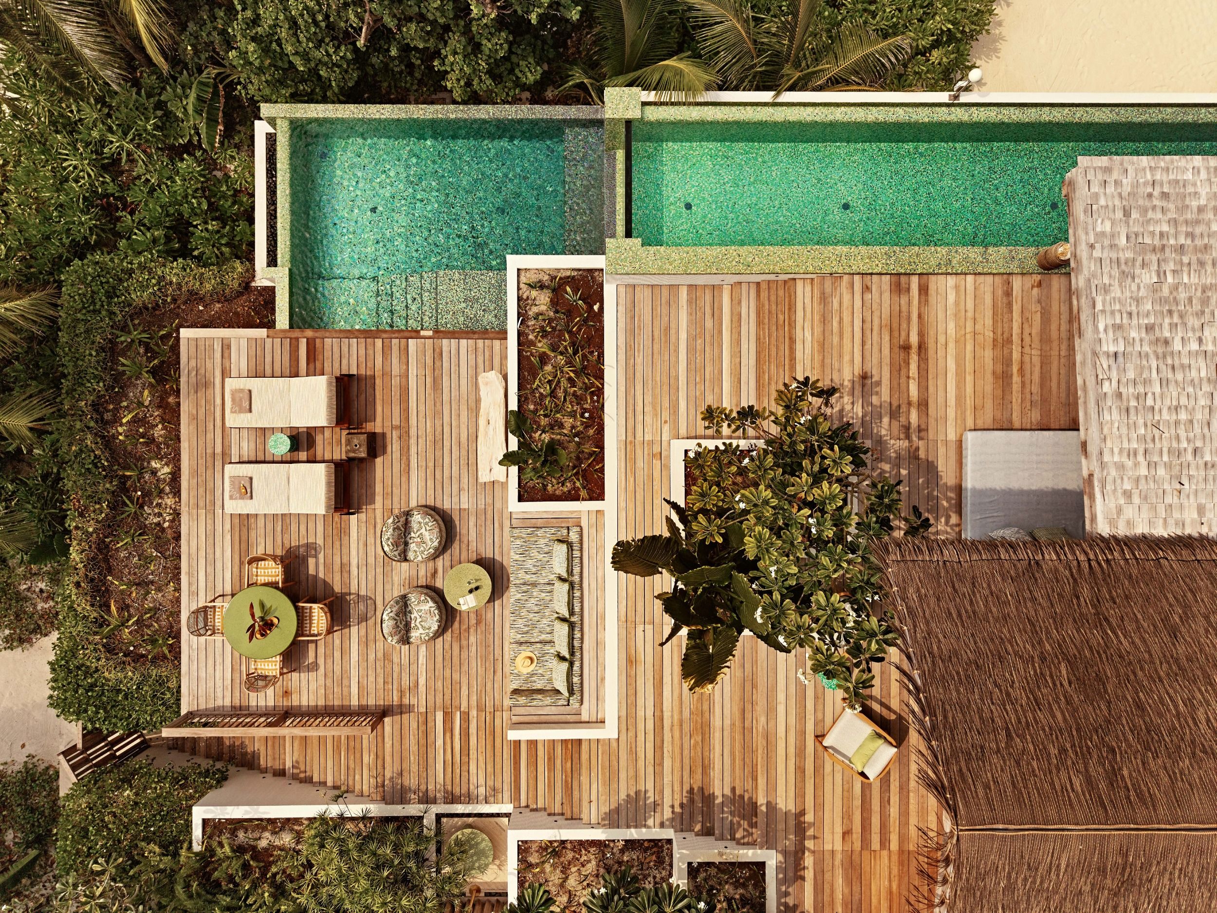 Aerial ocean-side view of three-bedroom residence