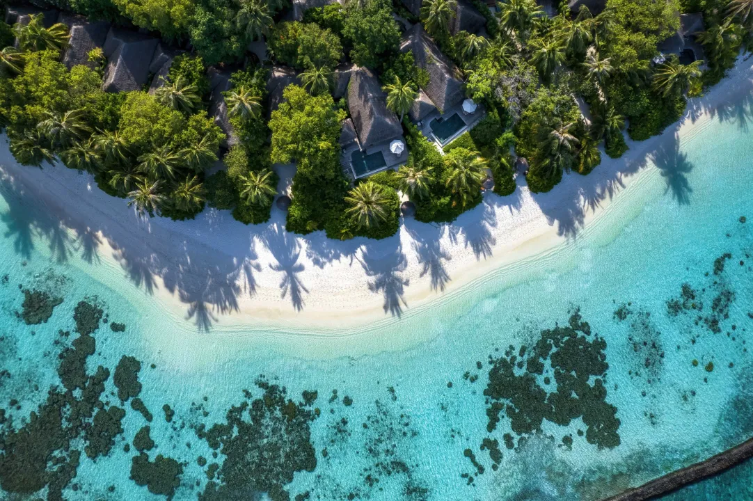 Baros Maldives island and surrounding house reef